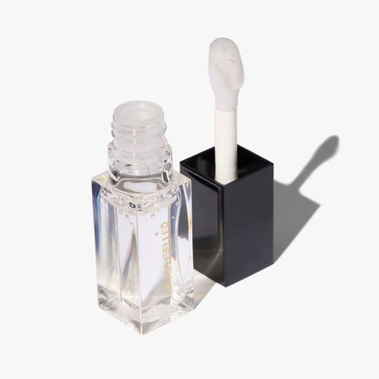 Fine Shine Glossy Lip Oil in glass half full